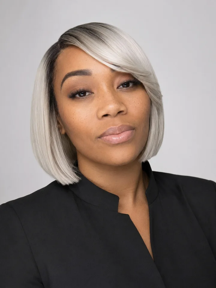 Elise Golphin, owner and master stylist of Magic Hair Boutique, wearing a platinum blonde bob