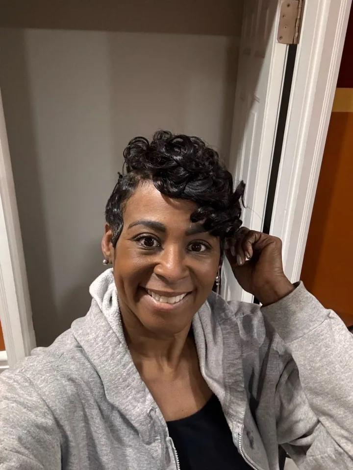 Client with a short pressed-curl style by Magic Hair Boutique