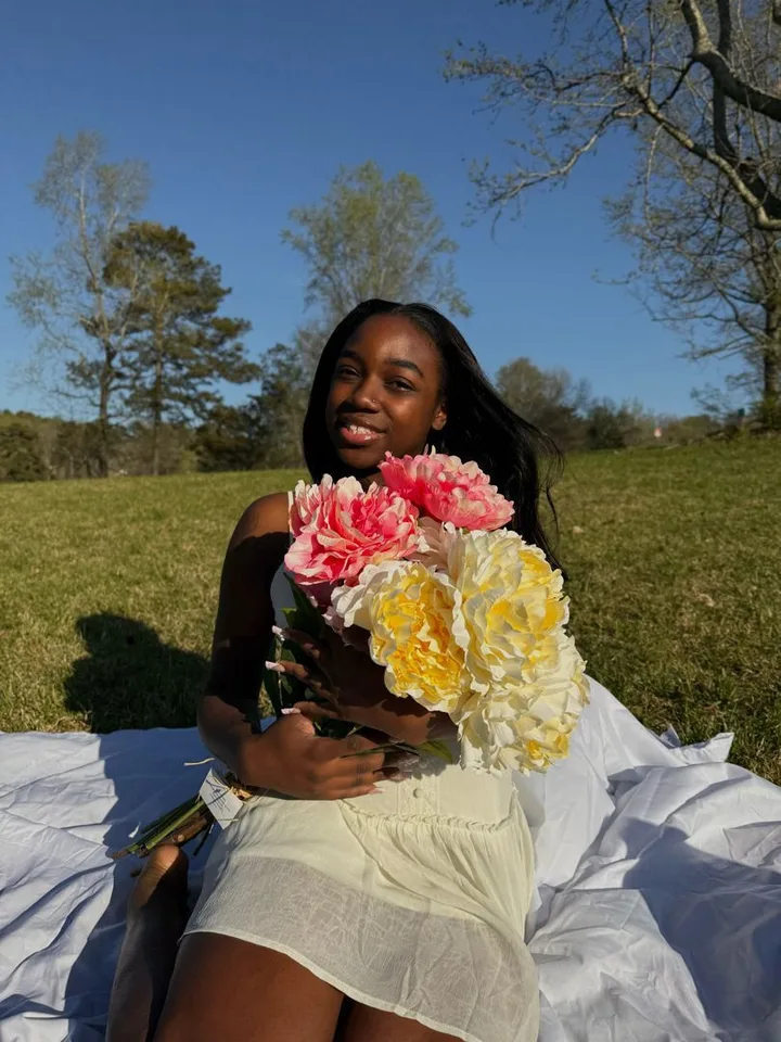 Client with a long sleek install by Magic Hair Boutique, photographed outdoors